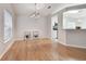 Hardwood floor dining room with adjacent kitchen and access to the outside at 25406 Lexington Oaks Blvd, Wesley Chapel, FL 33544