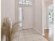Clean and spacious entryway with tile flooring at 25406 Lexington Oaks Blvd, Wesley Chapel, FL 33544