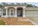 Front entryway with walkway and landscaping at 25406 Lexington Oaks Blvd, Wesley Chapel, FL 33544