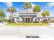 Lexington Oaks Golf Club entrance with palm trees at 25406 Lexington Oaks Blvd, Wesley Chapel, FL 33544