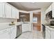 Updated kitchen with stainless steel appliances and white cabinetry at 25406 Lexington Oaks Blvd, Wesley Chapel, FL 33544