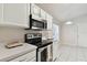 Bright kitchen with stainless steel appliances and white cabinets at 25406 Lexington Oaks Blvd, Wesley Chapel, FL 33544