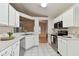 Updated kitchen with stainless steel appliances and white cabinetry at 25406 Lexington Oaks Blvd, Wesley Chapel, FL 33544