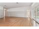 Hardwood floor living room with access to backyard and additional rooms at 25406 Lexington Oaks Blvd, Wesley Chapel, FL 33544