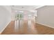 Open living area with hardwood floors and access to backyard at 25406 Lexington Oaks Blvd, Wesley Chapel, FL 33544