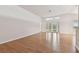 Bright living room with hardwood floors and sliding glass doors leading to backyard at 25406 Lexington Oaks Blvd, Wesley Chapel, FL 33544