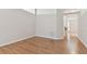Spacious living room with light walls and wood-look flooring at 25406 Lexington Oaks Blvd, Wesley Chapel, FL 33544