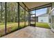 Relaxing screened porch overlooking backyard and wooded area at 25406 Lexington Oaks Blvd, Wesley Chapel, FL 33544
