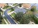 Aerial view of home showcasing backyard and neighborhood at 27325 Mistflower Dr, Wesley Chapel, FL 33544
