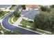 Single-Gathering house with gray roof, situated on a tree-lined street at 27325 Mistflower Dr, Wesley Chapel, FL 33544