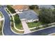 Single-Gathering house with gray roof, situated on a tree-lined street at 27325 Mistflower Dr, Wesley Chapel, FL 33544