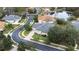 Aerial view of home with neighborhood and lake at 27325 Mistflower Dr, Wesley Chapel, FL 33544