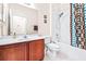 Clean bathroom with tub, shower, and wood vanity at 27325 Mistflower Dr, Wesley Chapel, FL 33544