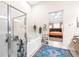 Bathroom boasts a soaking tub, walk-in shower, and access to bedroom at 27325 Mistflower Dr, Wesley Chapel, FL 33544