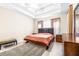 Main bedroom with a king-size bed and wood furniture at 27325 Mistflower Dr, Wesley Chapel, FL 33544