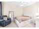 Comfortable bedroom with a large bed and plenty of storage at 27325 Mistflower Dr, Wesley Chapel, FL 33544
