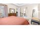 Spacious bedroom with ensuite bathroom access and large dresser at 27325 Mistflower Dr, Wesley Chapel, FL 33544