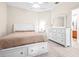 Bedroom with a queen bed, dresser, and ceiling fan at 27325 Mistflower Dr, Wesley Chapel, FL 33544