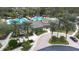 Resort-style community pool, clubhouse, and tennis courts at 27325 Mistflower Dr, Wesley Chapel, FL 33544
