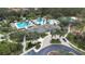 Aerial view of community pool, clubhouse and playground at 27325 Mistflower Dr, Wesley Chapel, FL 33544
