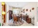 Bright dining room with hardwood floor, round table and buffet at 27325 Mistflower Dr, Wesley Chapel, FL 33544