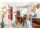 Bright dining room with hardwood floor, round table and buffet at 27325 Mistflower Dr, Wesley Chapel, FL 33544