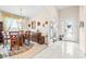 Bright entryway with tiled floor, leading to dining room and other areas at 27325 Mistflower Dr, Wesley Chapel, FL 33544
