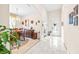 Bright entryway with tiled floor, leading to dining room and other areas at 27325 Mistflower Dr, Wesley Chapel, FL 33544