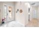 Clean entryway with tile floors, featuring decorative wall accents at 27325 Mistflower Dr, Wesley Chapel, FL 33544