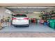 Attached garage with ample storage space and room for one vehicle at 27325 Mistflower Dr, Wesley Chapel, FL 33544