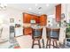 Kitchen with granite counters and wood cabinets at 27325 Mistflower Dr, Wesley Chapel, FL 33544