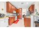 Spacious kitchen with granite counters and wood cabinets at 27325 Mistflower Dr, Wesley Chapel, FL 33544