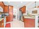 Spacious kitchen with granite counters and wood cabinets at 27325 Mistflower Dr, Wesley Chapel, FL 33544