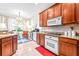 Bright kitchen with granite counters and breakfast nook at 27325 Mistflower Dr, Wesley Chapel, FL 33544