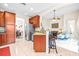 Kitchen with granite countertops, island, and breakfast bar at 27325 Mistflower Dr, Wesley Chapel, FL 33544
