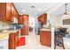 Spacious kitchen with granite counters and wood cabinets at 27325 Mistflower Dr, Wesley Chapel, FL 33544