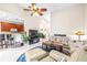 Open concept living room with kitchen views at 27325 Mistflower Dr, Wesley Chapel, FL 33544