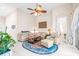 Bright living room with comfy seating and tile floors at 27325 Mistflower Dr, Wesley Chapel, FL 33544