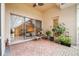 Bright patio with glass doors leading to the interior, showing a glimpse of the living room at 27325 Mistflower Dr, Wesley Chapel, FL 33544