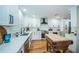 Modern kitchen with white shaker cabinets, quartz countertops, and stainless steel appliances at 3035 Countryside Blvd # 21B, Clearwater, FL 33761