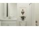 Clean bathroom with white vanity, tile shower, and neutral decor at 31537 Cardinal Yard Dr, San Antonio, FL 33576