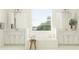 Spacious bathroom with double sinks,freestanding tub, and large window at 31537 Cardinal Yard Dr, San Antonio, FL 33576