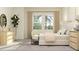 Spacious bedroom with king-size bed, two chairs, and ample natural light at 31537 Cardinal Yard Dr, San Antonio, FL 33576