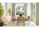 Dining area with wooden table, leather chairs, and a large window at 31537 Cardinal Yard Dr, San Antonio, FL 33576