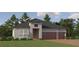 Two-story home with three-car garage, and a beautifully landscaped lawn at 31537 Cardinal Yard Dr, San Antonio, FL 33576
