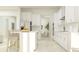 Modern kitchen with white cabinets, stainless steel appliances, and an island at 31537 Cardinal Yard Dr, San Antonio, FL 33576