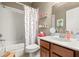 Bathroom with tub, shower, and polka-dot curtain at 3429 Durrance St, New Port Richey, FL 34655