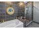 Spa-like bathroom with a soaking tub and glass shower at 400 4Th S Ave # 506, St Petersburg, FL 33701