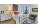 Cozy bedroom with white dresser and colorful rug at 400 4Th S Ave # 506, St Petersburg, FL 33701