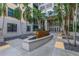 Courtyard entrance to condo building with tropical landscaping at 400 4Th S Ave # 506, St Petersburg, FL 33701